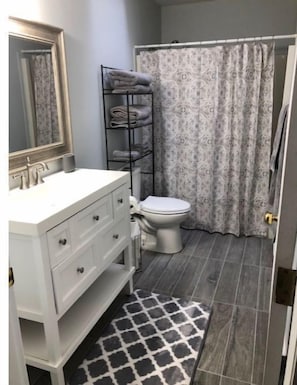 Combined shower/tub, hair dryer, towels, soap