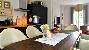 A modern kitchen with a dining area.