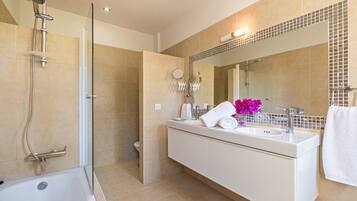 Bathtub, hair dryer, towels