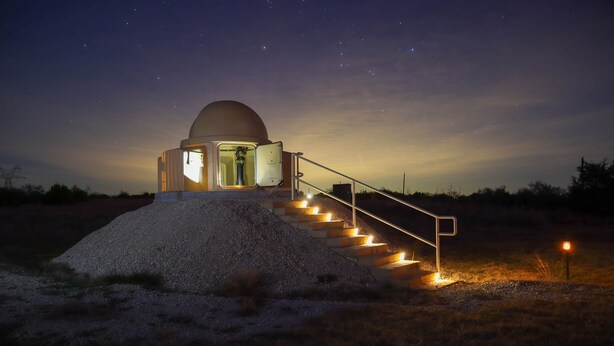 A dome-shaped observatory with a staircase leading up to it, surrounded by a grassy area. - Field House on Lake Godstone (Graford)