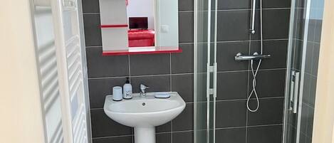 Shower, towels, soap, toilet paper
