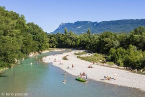 Enjoy serene riverside views and engage in activities like swimming, canoeing, and sunbathing.