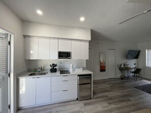 Fridge, microwave, stovetop, coffee/tea maker