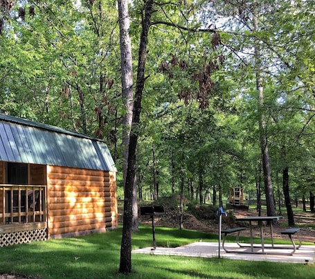 Property grounds. Small one room cabins with no bathrooms hot tub and covered picnic tables.