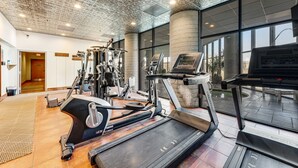 A gym with treadmills, ellipticals, and a piano. - Sixth-Floor Condo w/ a Shared Hot Tub, Pool, Free WiFi, & an Electric Fireplace (Sugar Mountain)