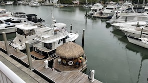 Mooring lines and buoys secure boats in this bustling marina, where vessels of all sizes offer a variety of amenities.