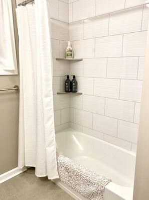 Combined shower/bathtub, hair dryer, towels, soap