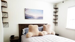A bedroom with a bed, a nightstand, a wall-mounted shelf, and a window. - Spacious Whole Residence w/ Bikes--Close to Beach! (Oceano)