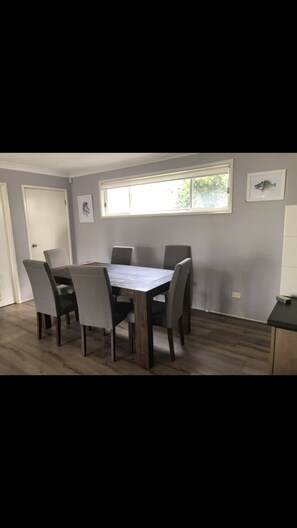 Enjoy meals in this cozy dining area with a large table and six chairs.