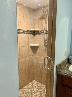 Combined shower/tub, hair dryer, towels, soap