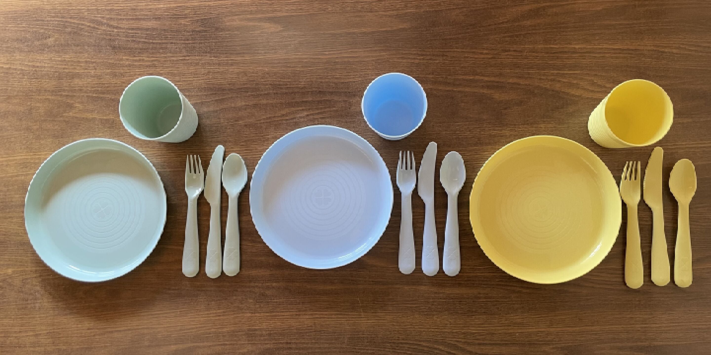 A table set with various bowls and cutlery.