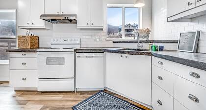 Lakefront retreat near town with spacious deck, free WiFi, beach access, & views