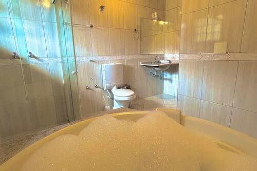 Quarto premium | Banheira de hidromassagem particular
