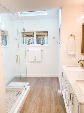 Bathtub, hair dryer, towels, soap