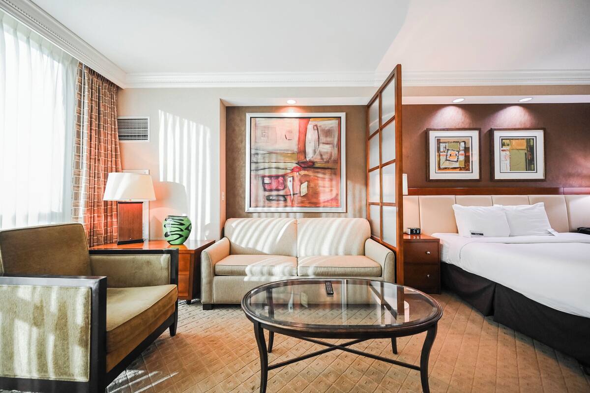Studio Two-Bedroom - Strip View | Living area | 30-inch TV with cable channels