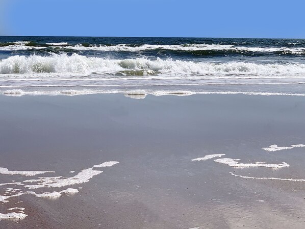 On the beach, sun loungers, beach towels