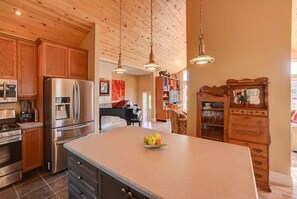 Enjoy cooking in this well-appointed kitchen with a large island and modern appliances.
