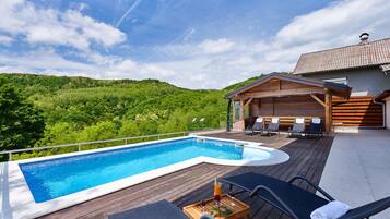 Outdoor pool, a heated pool, pool loungers