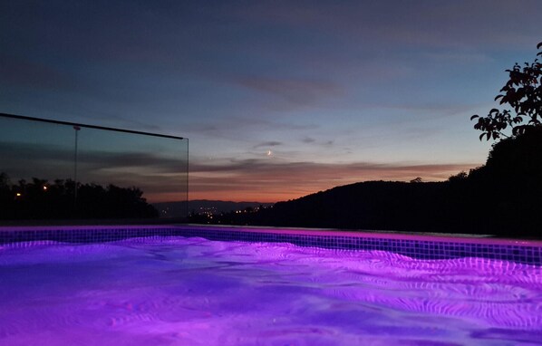Outdoor pool, a heated pool, sun loungers
