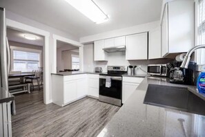 Fridge, microwave, oven, stovetop - The Cosmopolitan House (Tacoma)