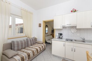 Private kitchen | Fridge, stovetop, espresso maker, electric kettle - Apartments Ivanka on the Beach (Vodice)