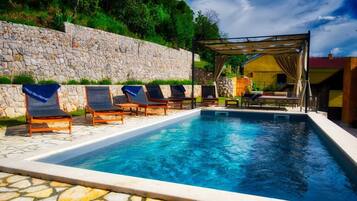 Outdoor pool, a heated pool, pool loungers