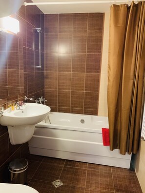 Apartment | Bathroom | Separate tub and shower, deep soaking tub, hair dryer, towels