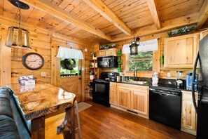 Fridge, microwave, oven, stovetop - This cabin is a 2 bedroom(s), 2 bathrooms, located in Sevierville, TN. (Sevierville)