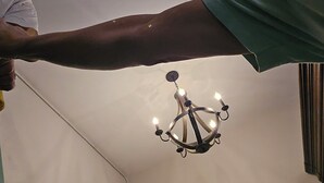 A chandelier with multiple lights hanging from the ceiling.