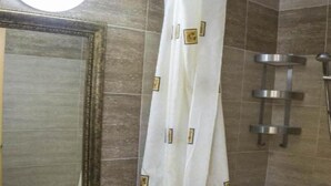 A bathroom with a sink, mirror, shower, and a curtain. - Elite Apartments Complex II III IV (Sunny Beach)