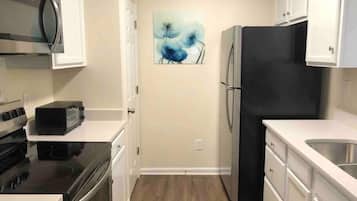 Microwave, toaster, cookware/dishes/utensils, dining tables