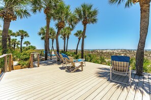 A wooden deck with lounge chairs and a view of the beach. - Family Villa | Ocean/Pool Views, Balcony, Bikes, Close to Shops/Dining (Hilton Head Island)