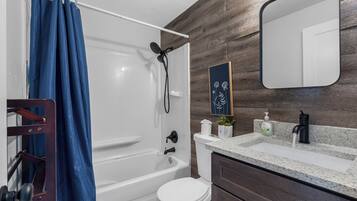 Combined shower/bathtub, hair dryer, towels, soap