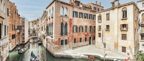 A canal in Venice with historic buildings and gondolas.