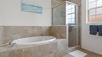 Combined shower/tub, hair dryer, towels, soap