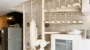 A bunk bed with a netted ladder and a white pillow on top. - Nikiti Beach (Sithonia)