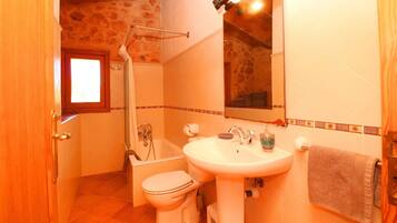 Bathtub, hair dryer, towels