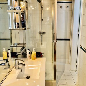 Shower, hair dryer, towels, soap