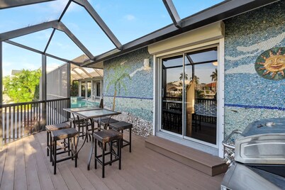 Waterfront Perfection! Beautiful New Dock, Heated Saltwater Pool and Spa.