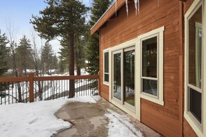 A wooden cabin with large windows and a covered porch. - Incline Village Manor Near Beach & More! (Incline Village)