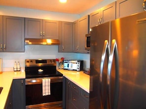Condo, 1 Queen Bed with Sofa bed, Lanai, Ocean View (Sea Village #4210) | Private kitchen | Fridge, microwave, oven, stovetop