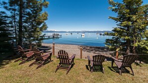 A lakeside view with wooden chairs and a dock. - West Lake Serenity 180 Degree Lake Views (Homewood)