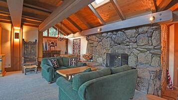 House, Multiple Beds, Balcony | Living room | 40-inch TV with cable channels, fireplace