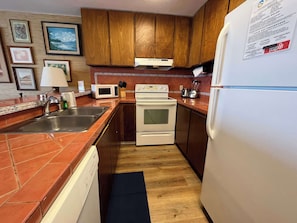 Condo, 1 King Bed, Balcony, Ocean View (Sea Village #1303) | Private kitchen | Fridge, microwave, oven, stovetop