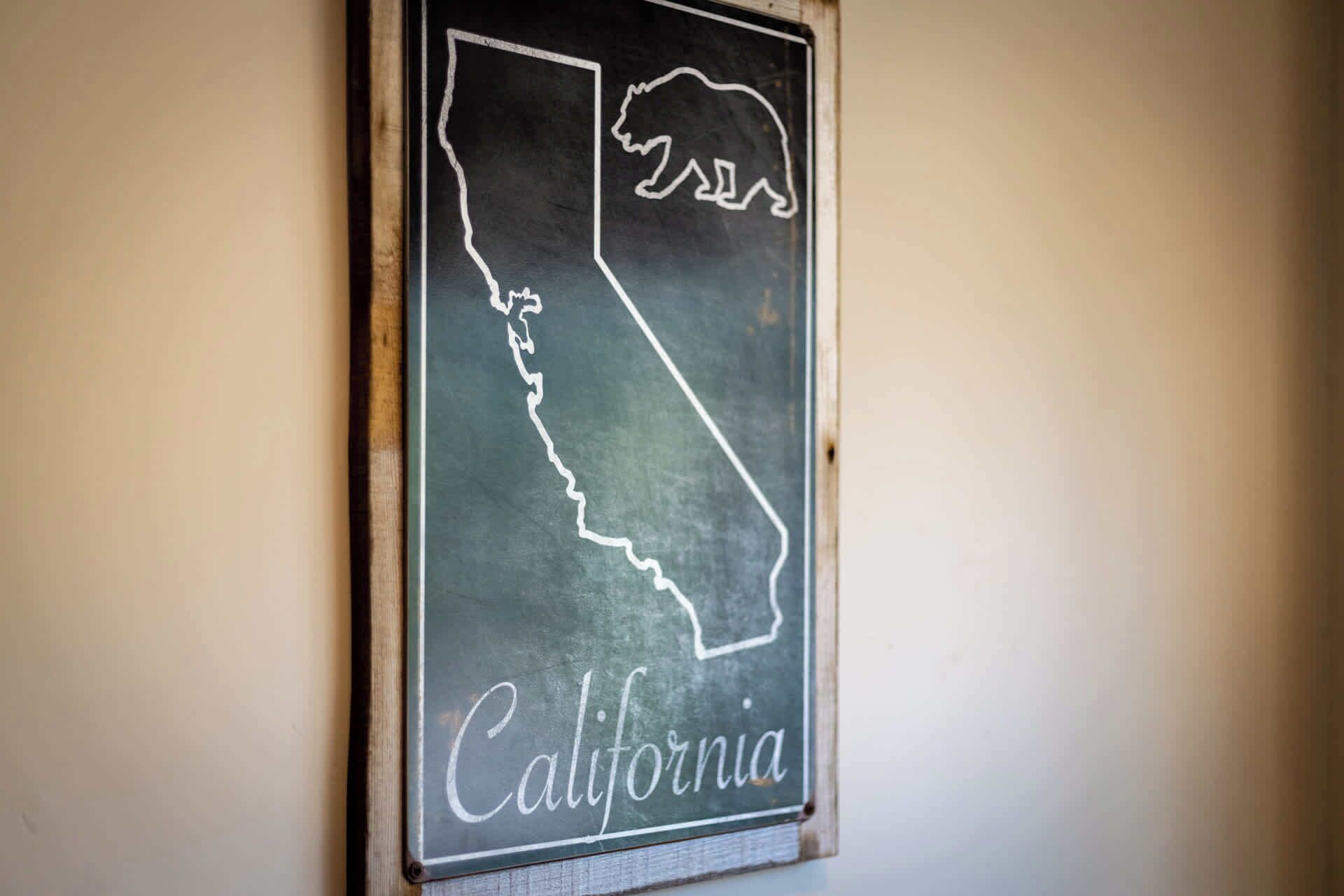 A chalkboard sign with the outline of California and the word "California" written on it.