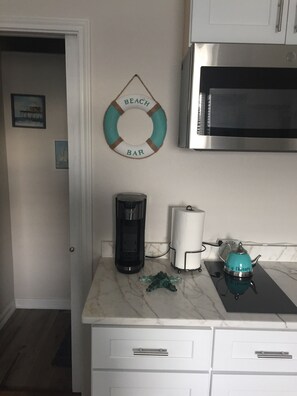 Fridge, microwave, stovetop, coffee/tea maker