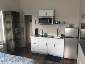 Fridge, microwave, stovetop, coffee/tea maker