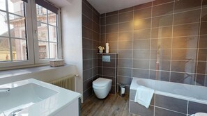 Bathtub, hair dryer, towels, soap