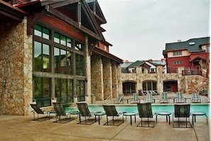 Relax in style with a pool and lounge chairs, plus balconies and a covered patio.
