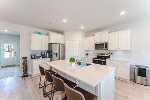 Fridge, microwave, oven, stovetop - Beach House with Golf Cart, Grill & Two Pools! (Port Saint Joe)